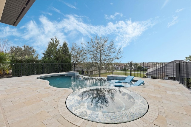 view of pool featuring a patio area, a pool with connected hot tub, and fence