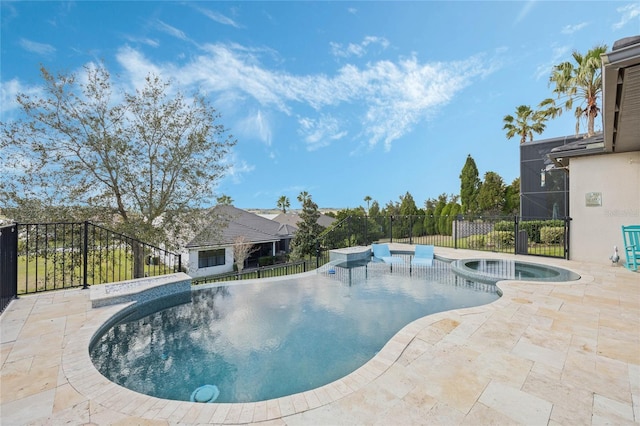 view of pool with a patio area, fence, and a pool with connected hot tub