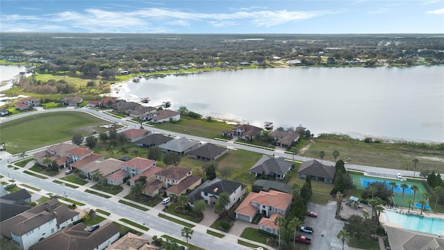 bird's eye view with a water view and a residential view