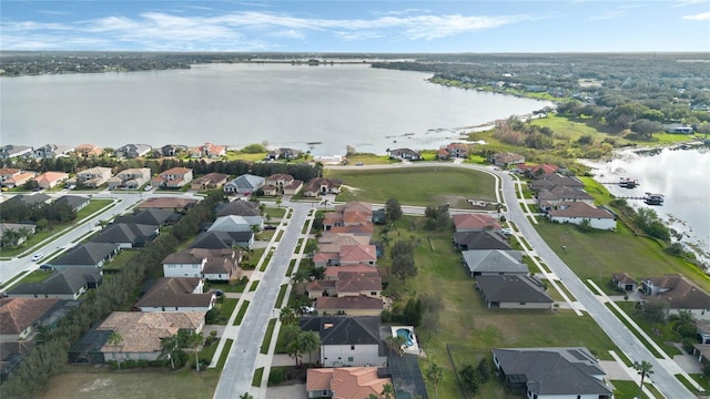 birds eye view of property featuring a water view and a residential view