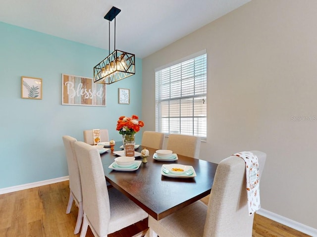 dining space featuring light wood-type flooring