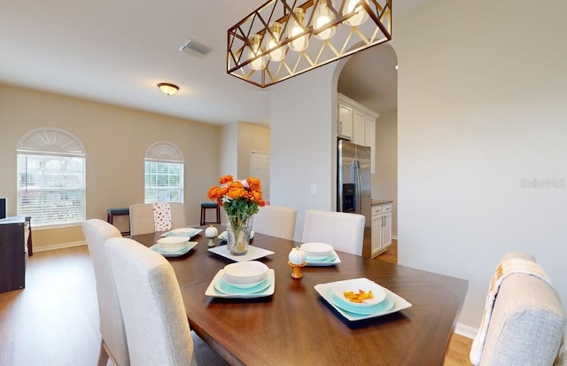 dining area featuring hardwood / wood-style floors