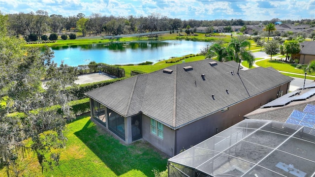 birds eye view of property with a water view