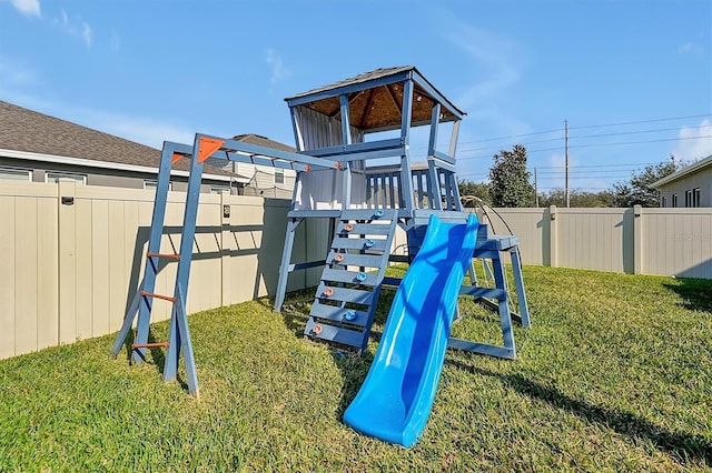 view of jungle gym with a lawn