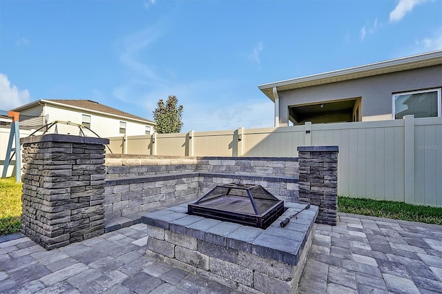 view of patio / terrace featuring a fire pit