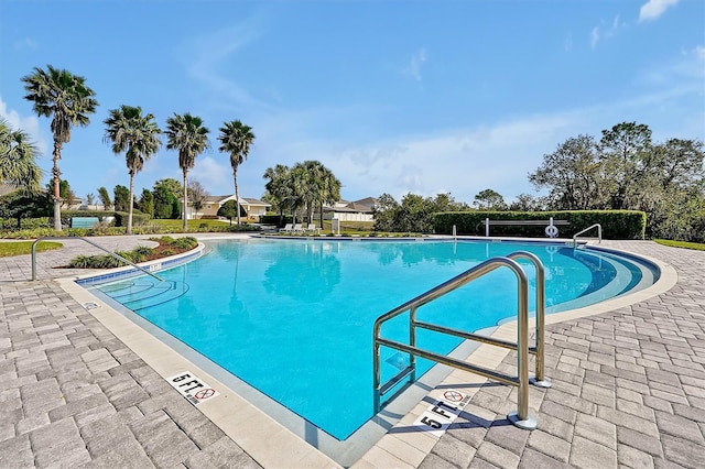 view of swimming pool with a patio area