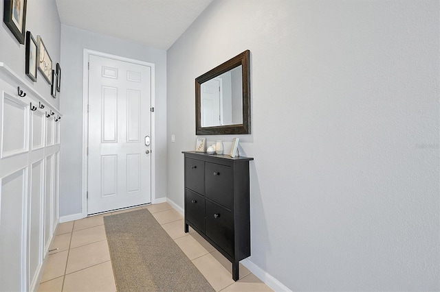 entryway featuring light tile patterned floors