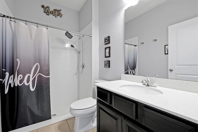 bathroom with a shower with curtain, vanity, tile patterned floors, and toilet