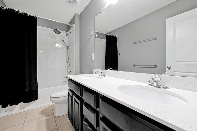 full bathroom featuring tile patterned floors, toilet, shower / bath combo with shower curtain, and vanity