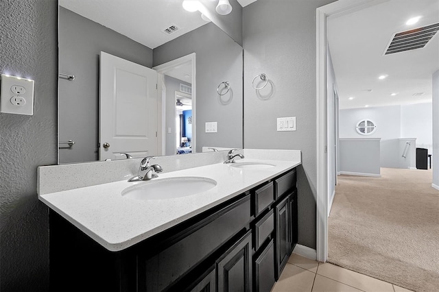 bathroom with vanity and tile patterned flooring