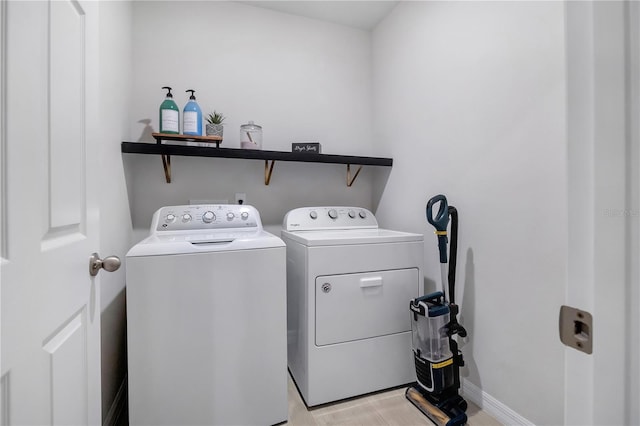 clothes washing area featuring washing machine and clothes dryer