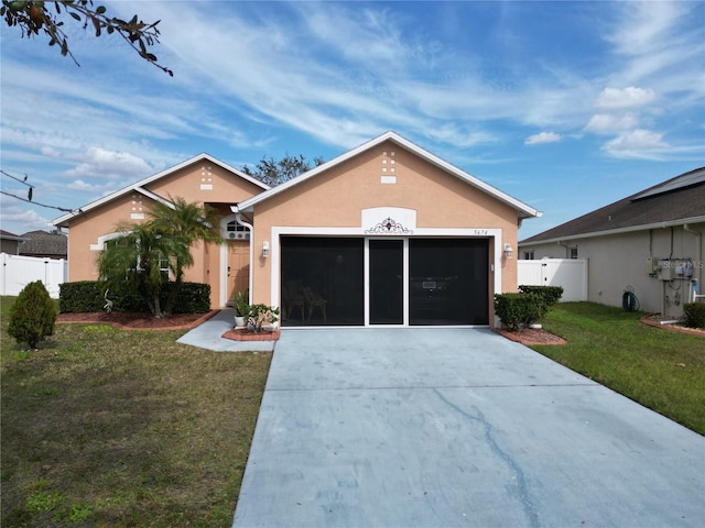 single story home with a garage and a front lawn