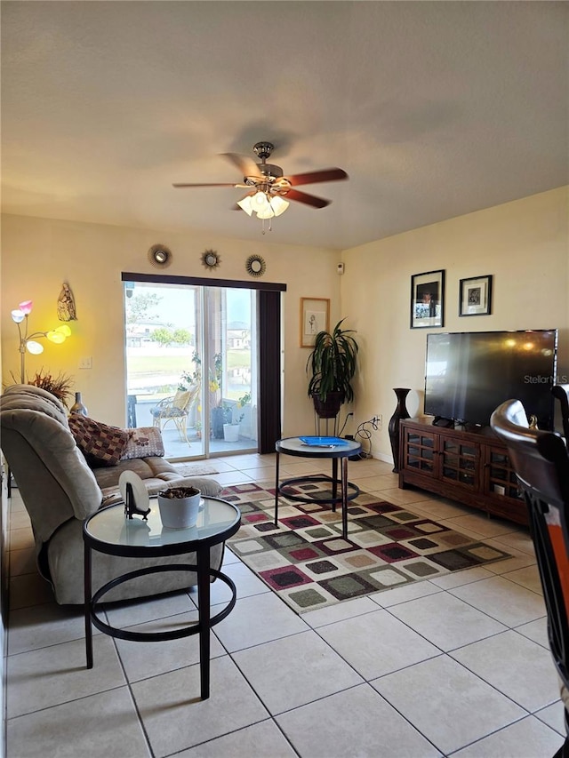 tiled living room with ceiling fan