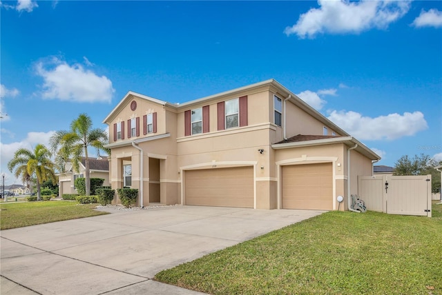 view of front of home with a garage and a front lawn