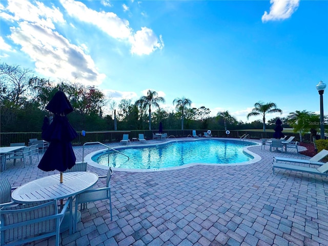 view of swimming pool featuring a patio