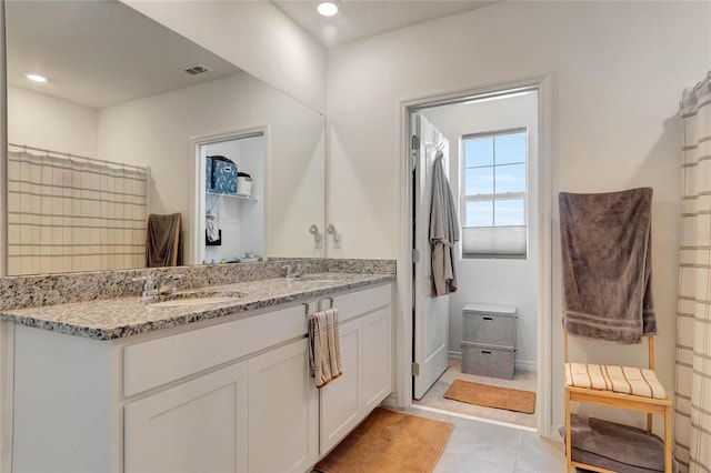 bathroom featuring vanity and tile patterned flooring