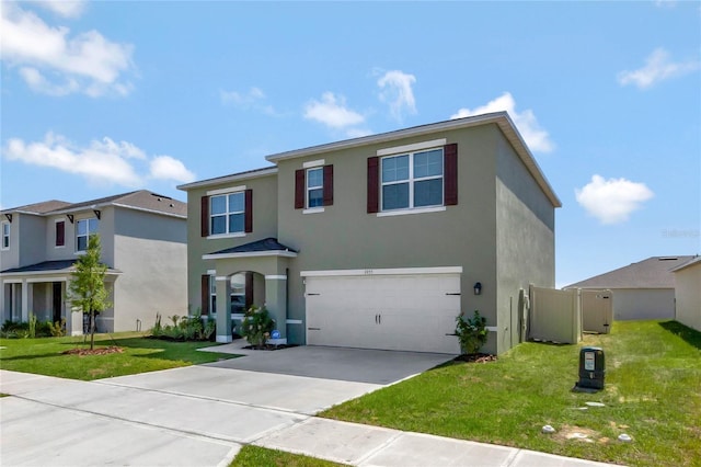 view of front of house featuring a garage and a front lawn