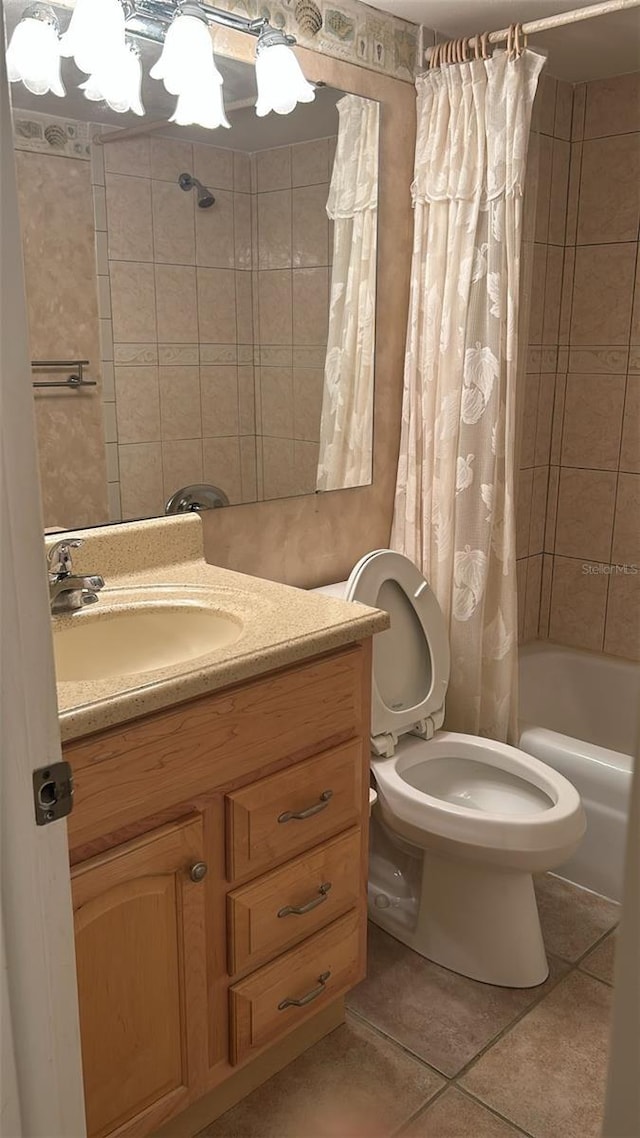 full bathroom featuring tile patterned flooring, vanity, shower / bath combination with curtain, and toilet