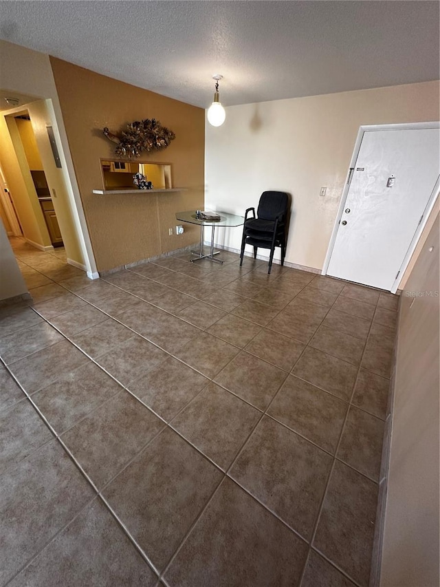 interior space featuring a textured ceiling