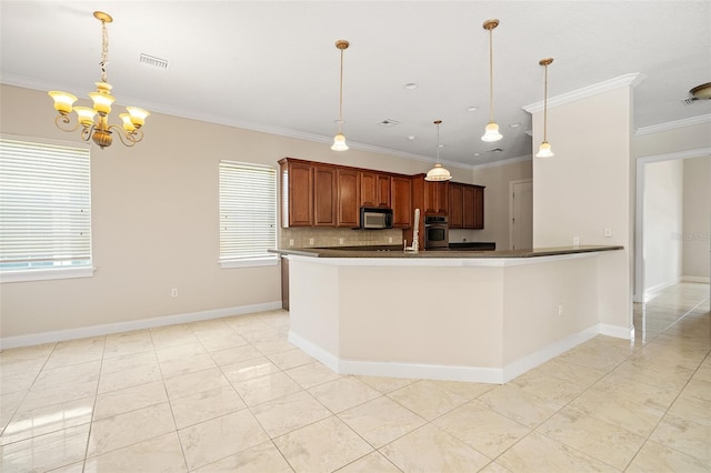 kitchen with visible vents, dark countertops, oven, crown molding, and pendant lighting