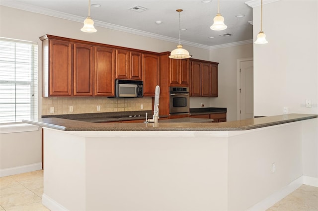 kitchen featuring stainless steel microwave, dark countertops, visible vents, and decorative backsplash