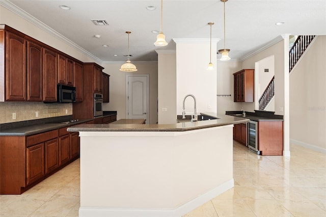 kitchen with a sink, visible vents, appliances with stainless steel finishes, decorative backsplash, and dark countertops