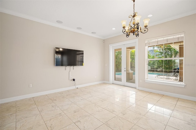 empty room featuring baseboards, ornamental molding, a notable chandelier, and french doors