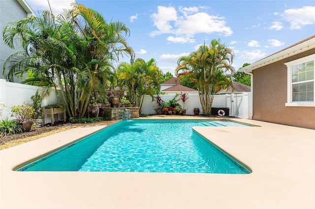 view of swimming pool with a patio, a gate, a fenced backyard, and a fenced in pool