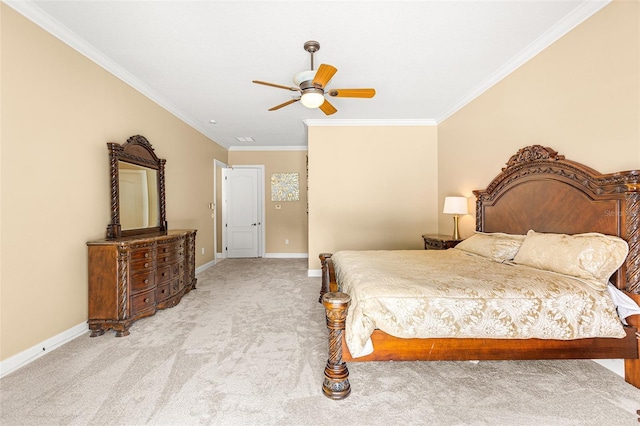 carpeted bedroom with baseboards, ceiling fan, and crown molding