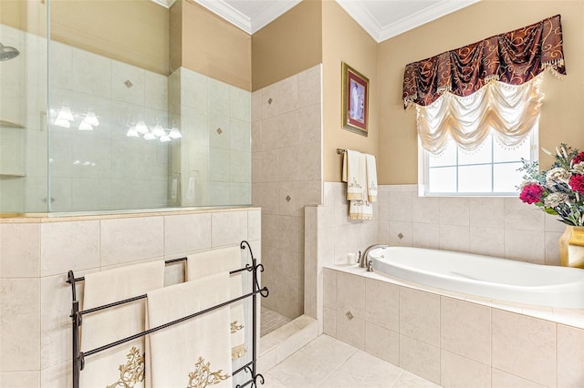 bathroom featuring a garden tub, a walk in shower, crown molding, and tile patterned floors