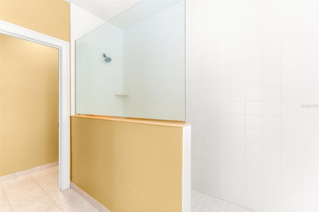 full bath with a walk in shower and tile patterned floors