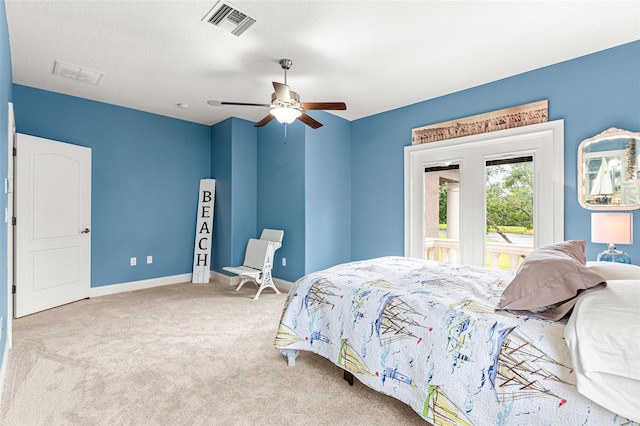 bedroom with carpet floors, visible vents, ceiling fan, a textured ceiling, and baseboards