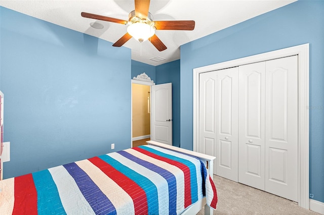 bedroom featuring ceiling fan, a closet, carpet, and visible vents