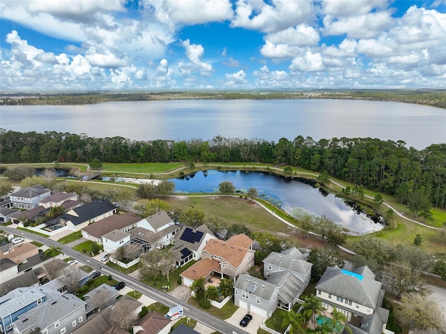 aerial view with a residential view and a water view