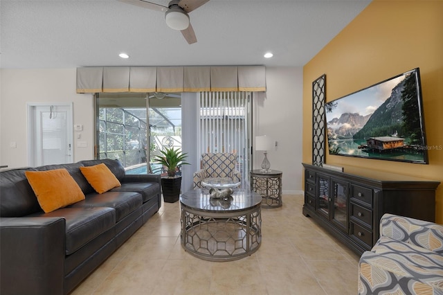 living room featuring light tile patterned floors and ceiling fan