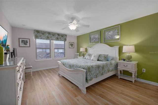 bedroom featuring ceiling fan and light hardwood / wood-style floors