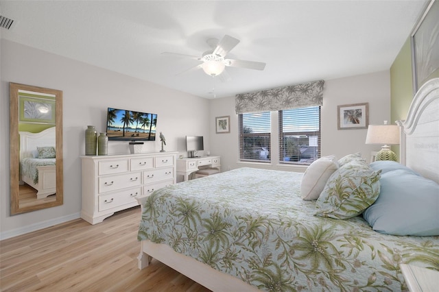 bedroom with light hardwood / wood-style flooring and ceiling fan