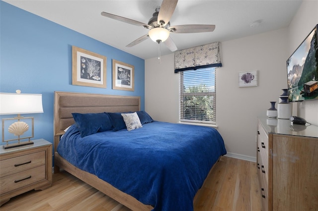 bedroom featuring ceiling fan and light hardwood / wood-style flooring