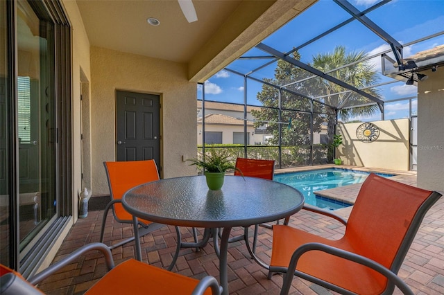 view of patio / terrace with a lanai and a fenced in pool