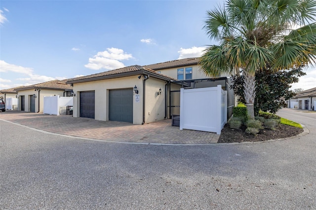 view of front of property with a garage