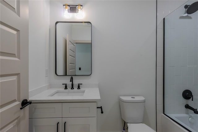 bathroom featuring toilet, tub / shower combination, and vanity