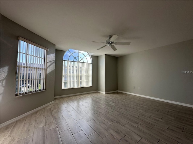 unfurnished room featuring ceiling fan and light wood-type flooring