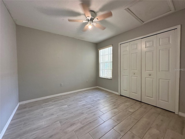 unfurnished bedroom featuring a closet, ceiling fan, and light hardwood / wood-style flooring