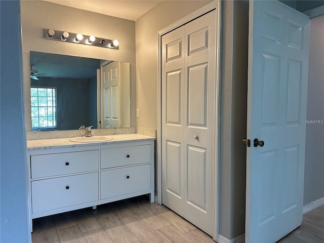 bathroom with vanity and ceiling fan