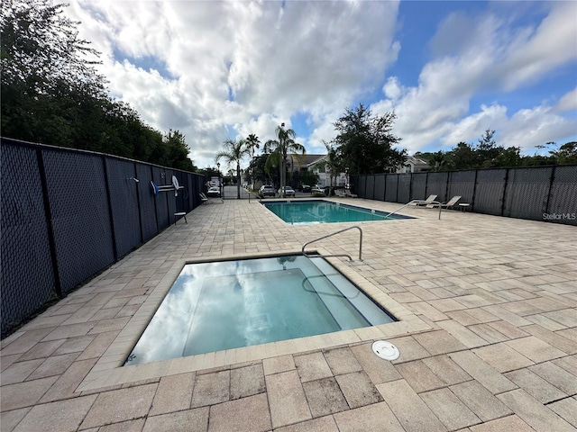 view of swimming pool with a patio area