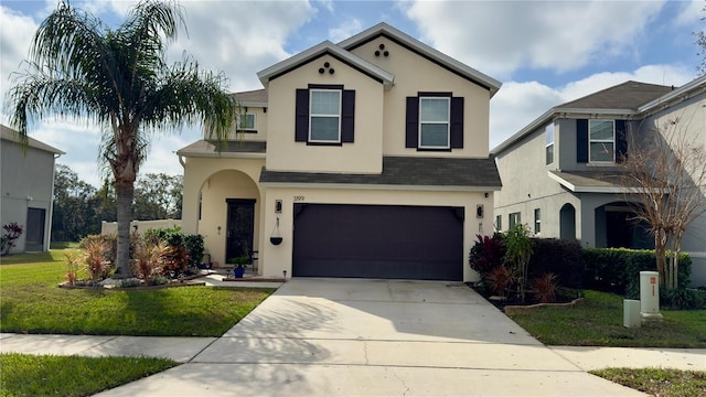 view of front of home featuring a garage and a front lawn