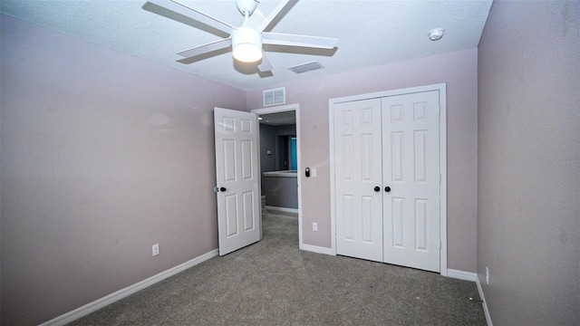 unfurnished bedroom with visible vents, carpet floors, baseboards, and a closet