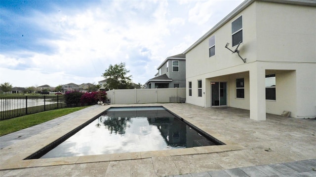 view of pool with a fenced in pool, a patio, and a fenced backyard