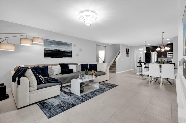 living room featuring an inviting chandelier and light tile patterned flooring