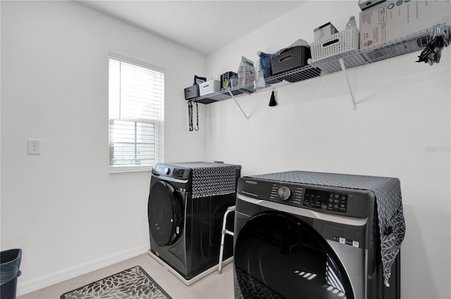 washroom with washing machine and dryer